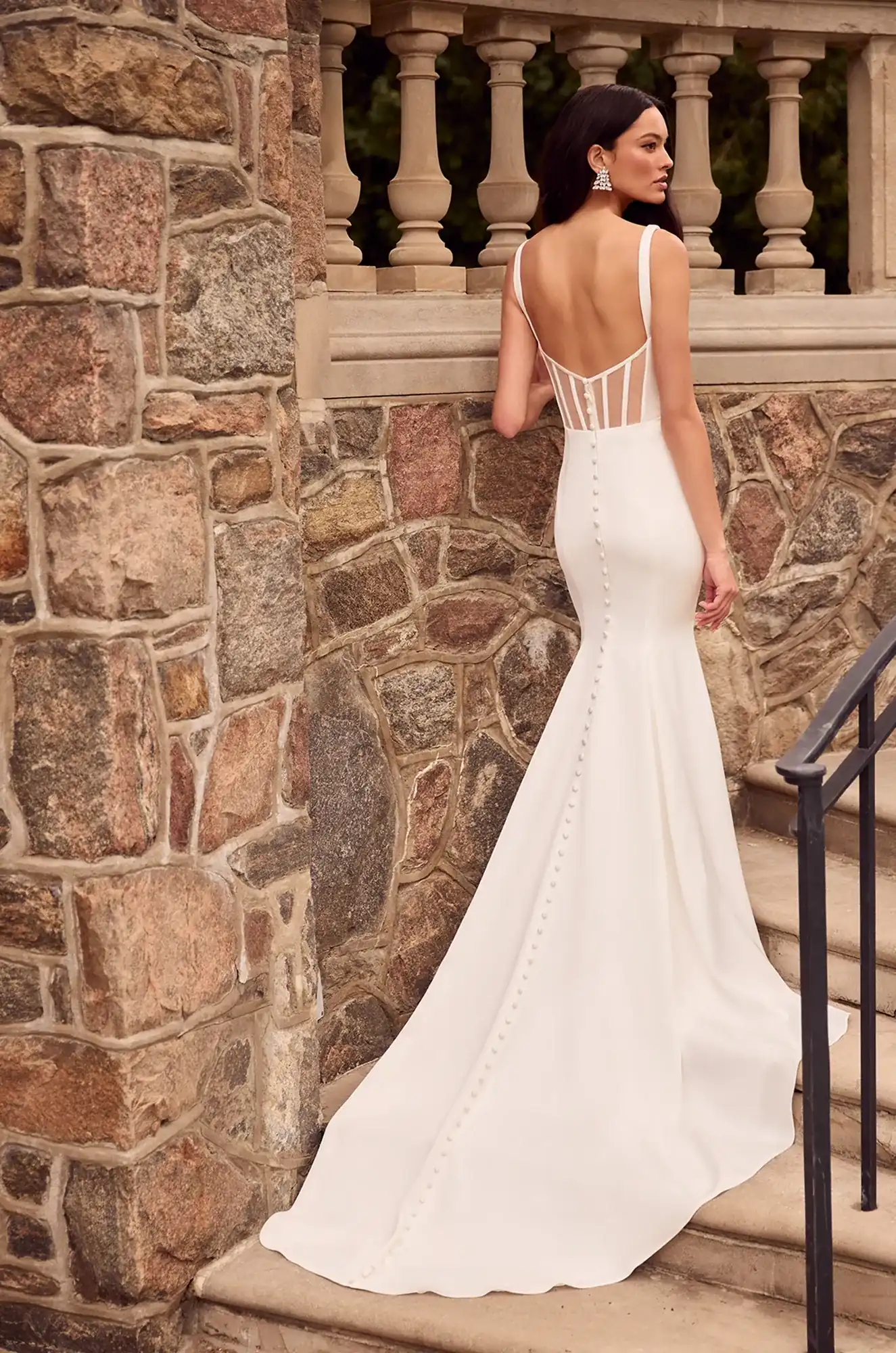 Wedding dress back view showing square neckline and sleek satin mermaid silhouette train.
