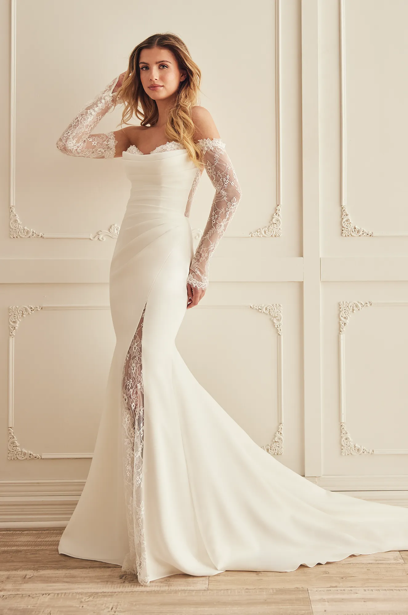 Strapless fit and flare crepe wedding dress with a lace-trim sweetheart neckline, and front lace insert slit.