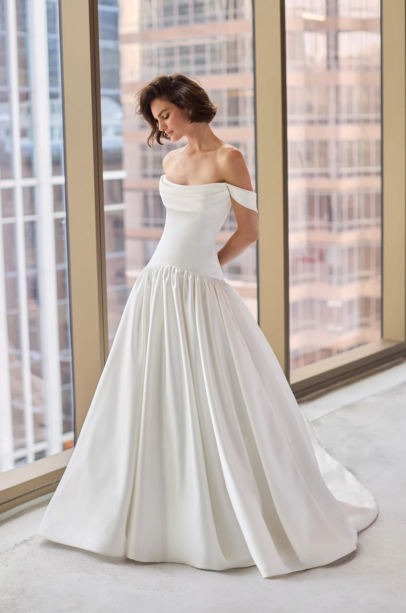 Satin gown with detachable draped sleeves and scoop neckline, with a strapless drop waisted bodice and gathered ball gown skirt.