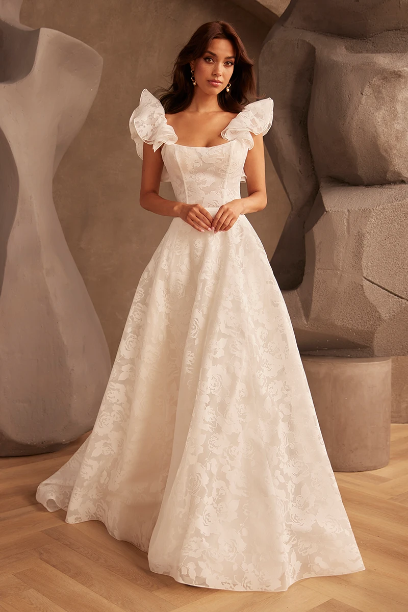 Sleeveless scoop neck wedding dress with floral embroidery, fitted bodice and A-line gown.