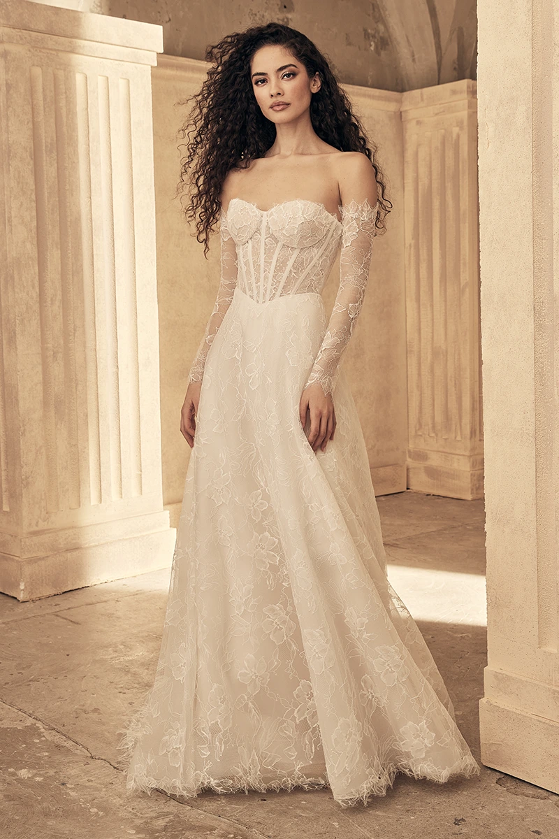 Off-shoulder lace wedding dress with long sleeves, corset bodice, and A-line skirt, ivory lace.