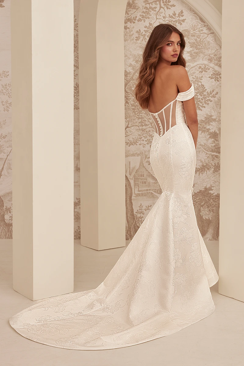 Off-shoulder Jacquard wedding gown with floral texture, and high front slit creating a sleek, modern silhouette.