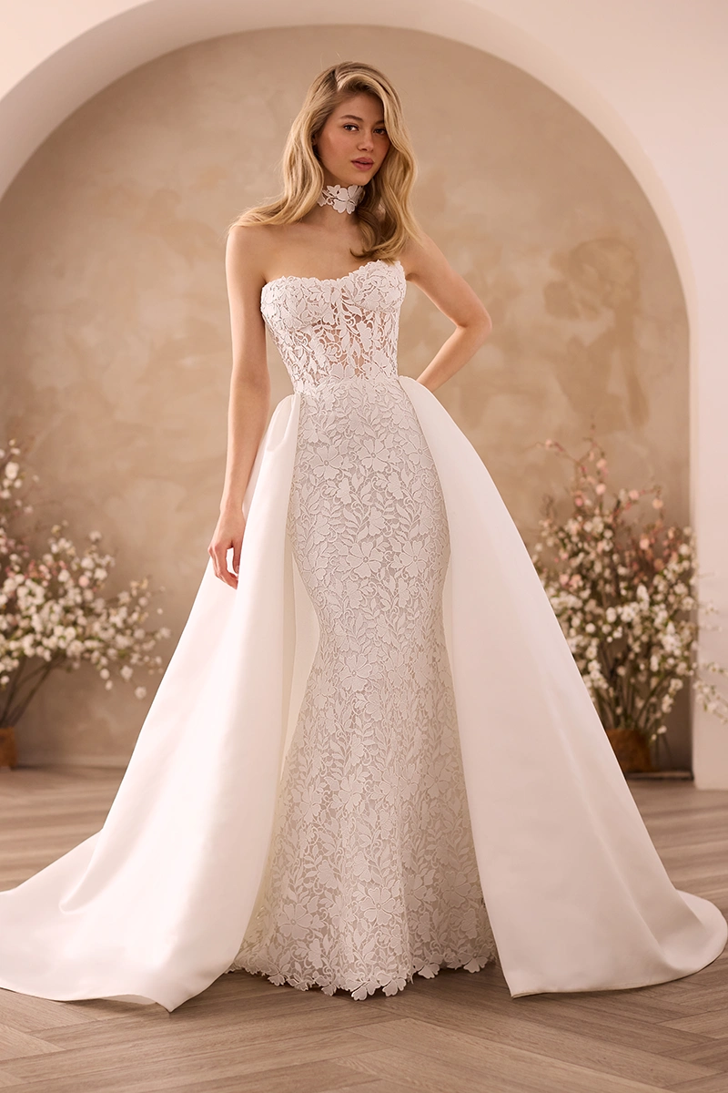 Lace gown with strapless sheer Lace bodice and fit and flare skirt with a detachable Satin train and a Lace choker.