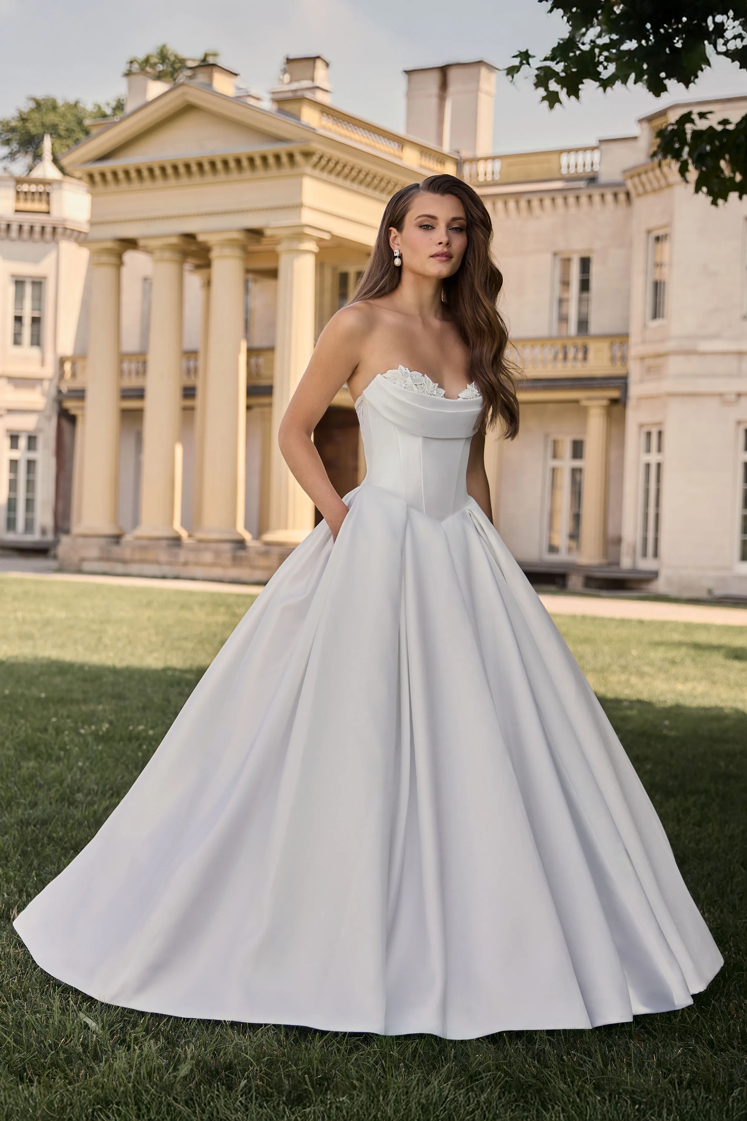 Strapless Satin ball gown with lace sweetheart neckline and Basque waistline, with pleated skirt.