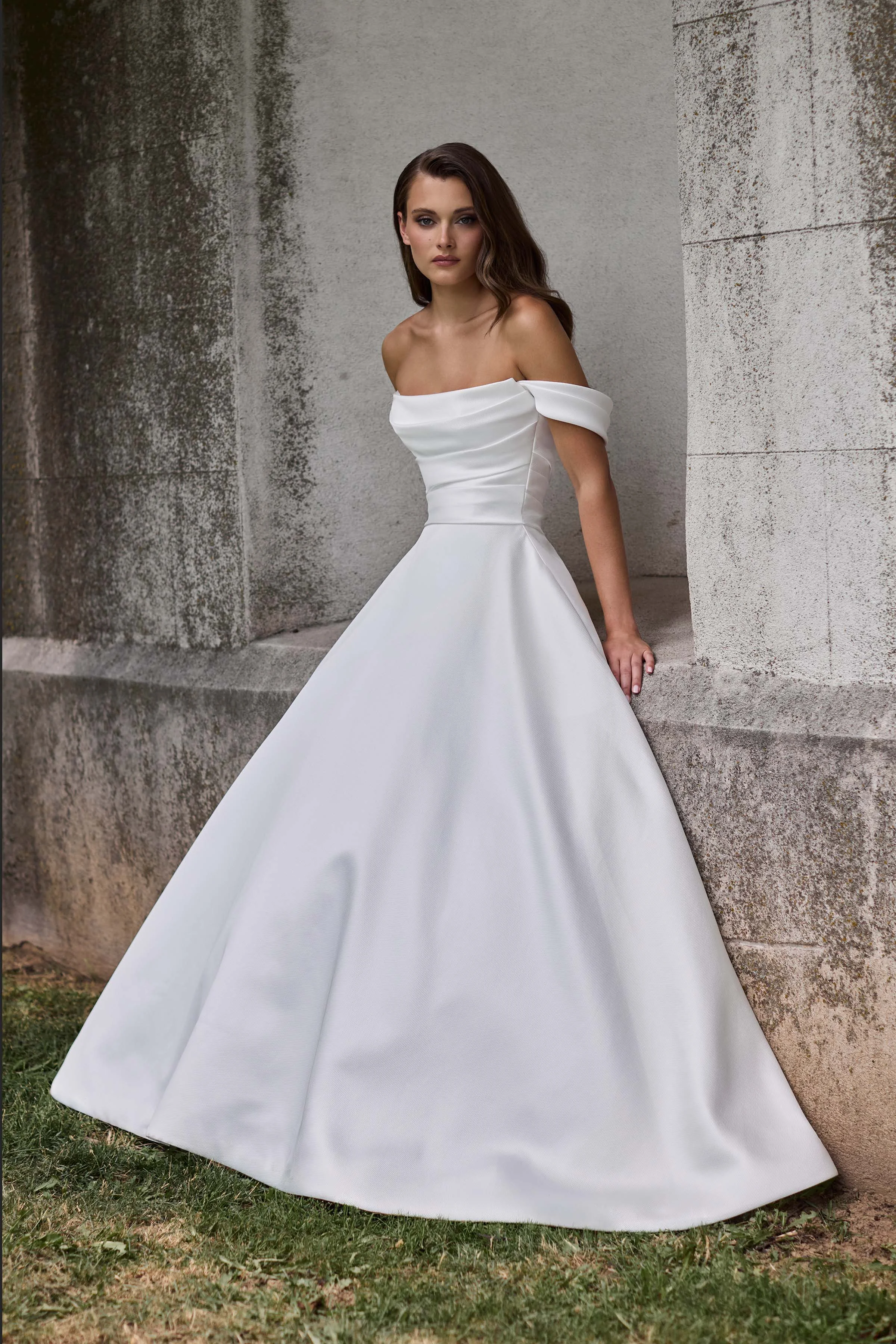 Scoop neckline Mikado gown with a draped bodice and draped sleeves, with a full circle skirt.