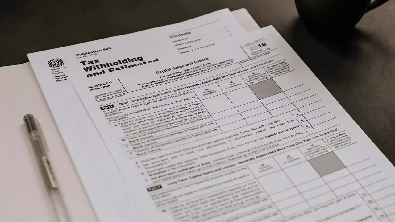 A stack of tax documents laying on a table