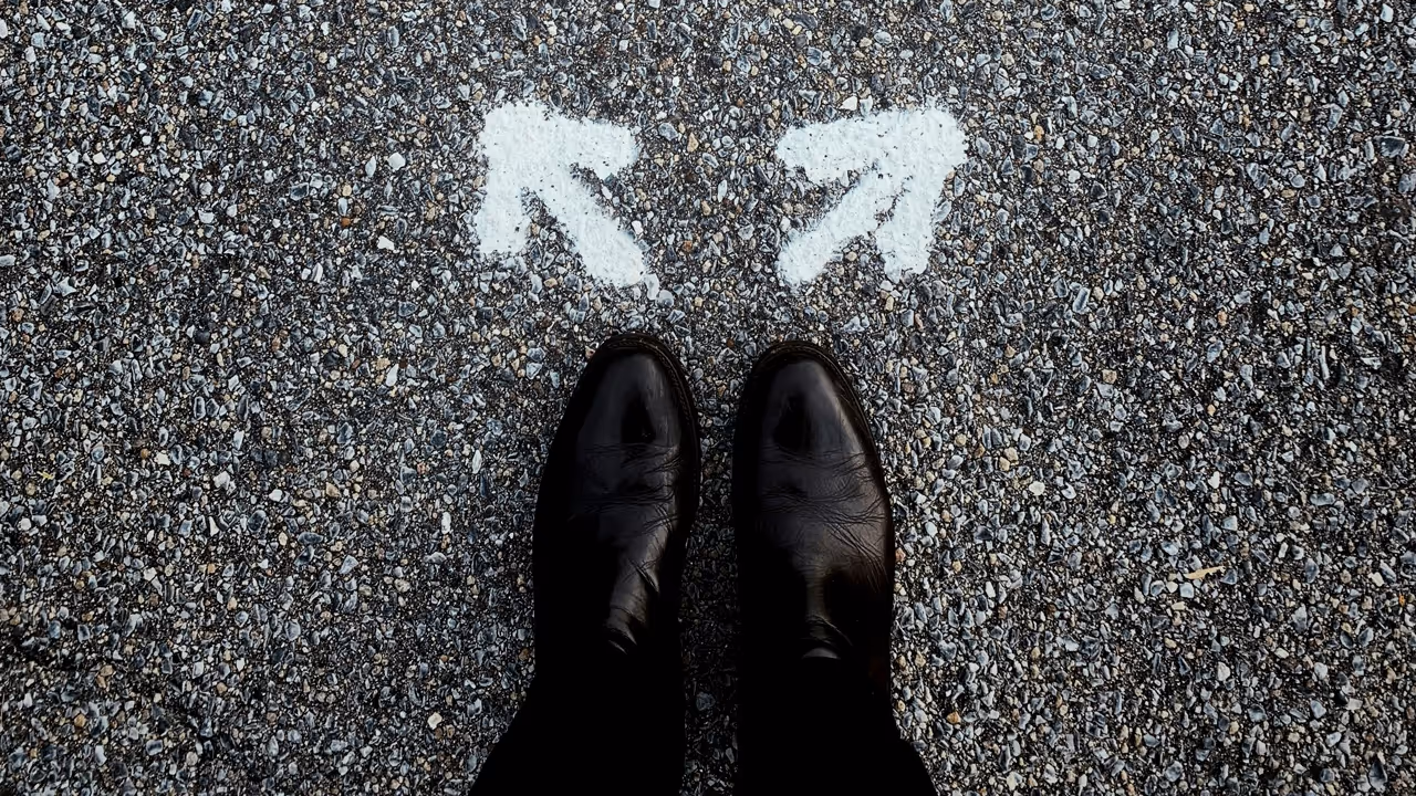 Arrows at someone's feet pointing in different direcitons.