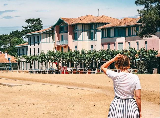 Person observing Basco-Landes architecture buildings in Hossegor