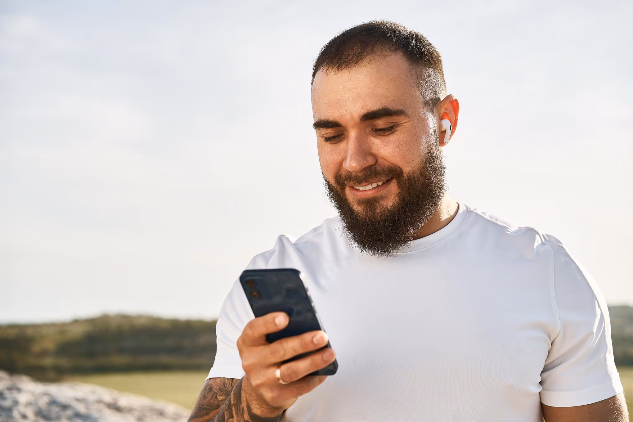Young man holding cell phone