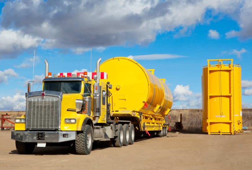 Yellow fuel transport truck with tanks