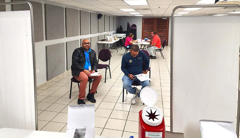 Department of Housing employees waiting to be vaccinated.