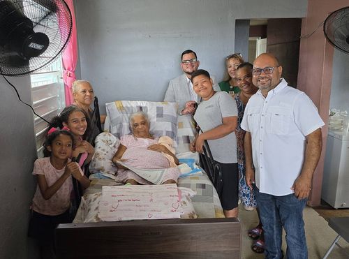 Attorney Omar Figueroa and government officials along with Norberta Ramos and her family.