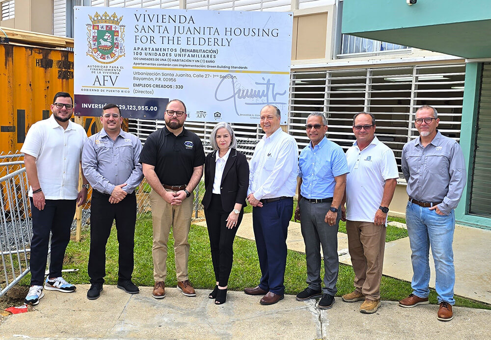 Representatives from different government agencies in front of Santa Juanita Housing for the Elderly.