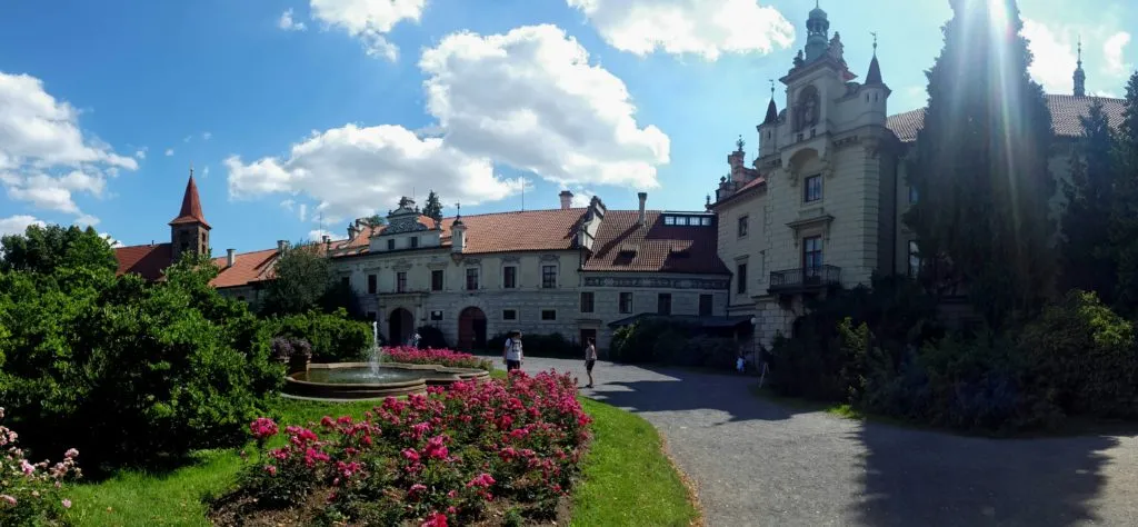 Pruhonice Castle with Neo-Renaissance facade and large park.