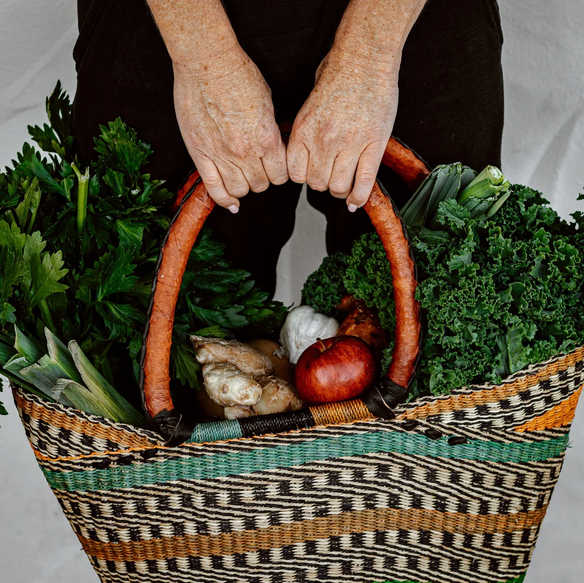 Basket of fresh organic fruit and vegetables featured by Flannerys