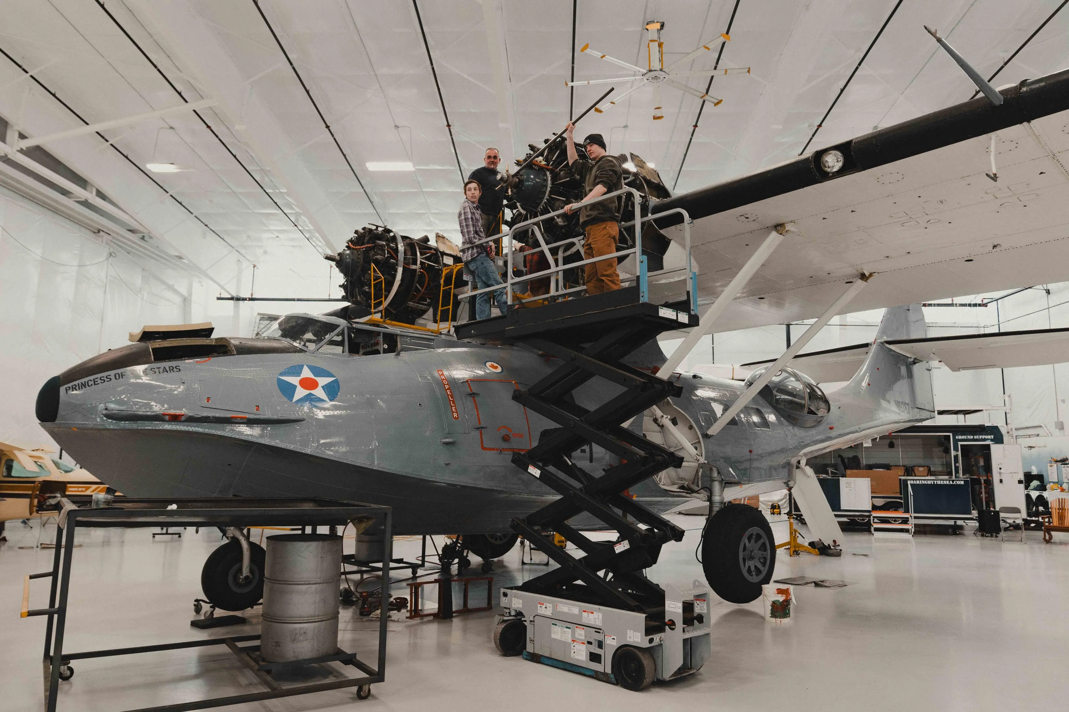 Mechanics working on Soaring by the Sea's 1943 PBY-5A Catalina