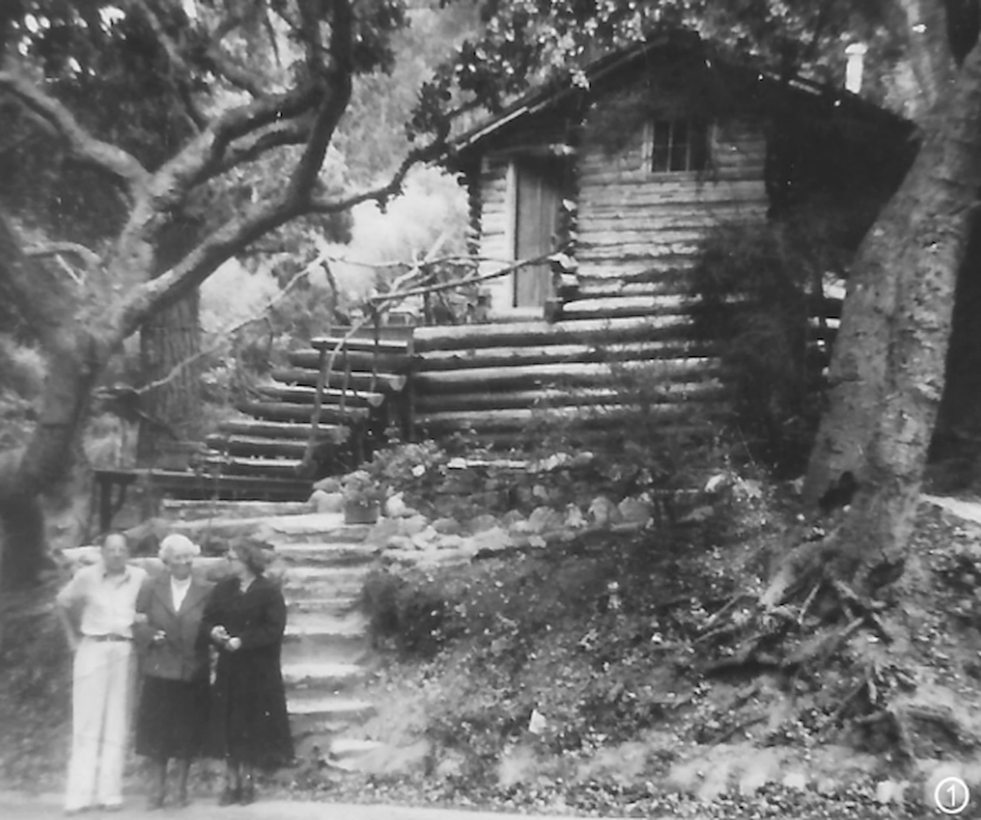 Jeffer's Cabin home in Carmel-by-the-Sea showing the original photo of the famous log cabin which was redesigned by Julia Correia