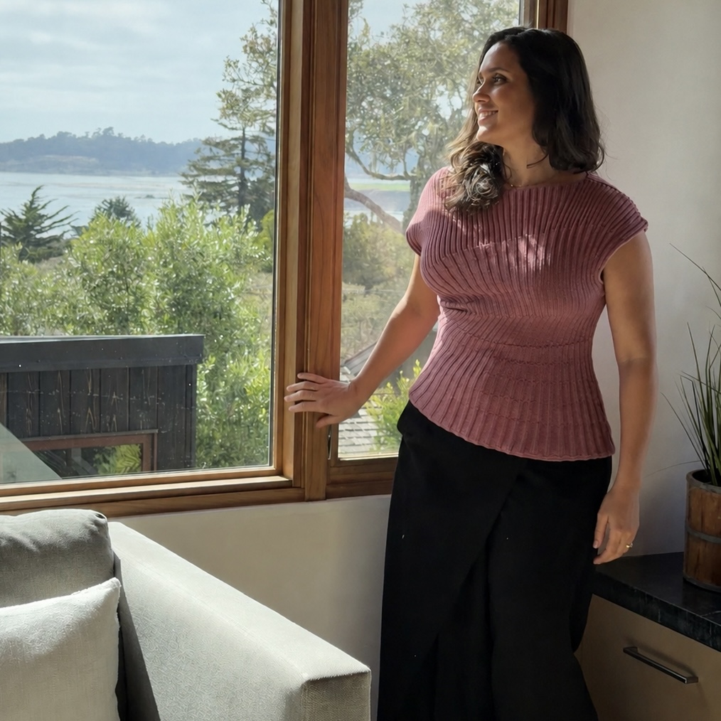 Julia Correia at Brisa, looking out over Carmel Bay from the living room she designed