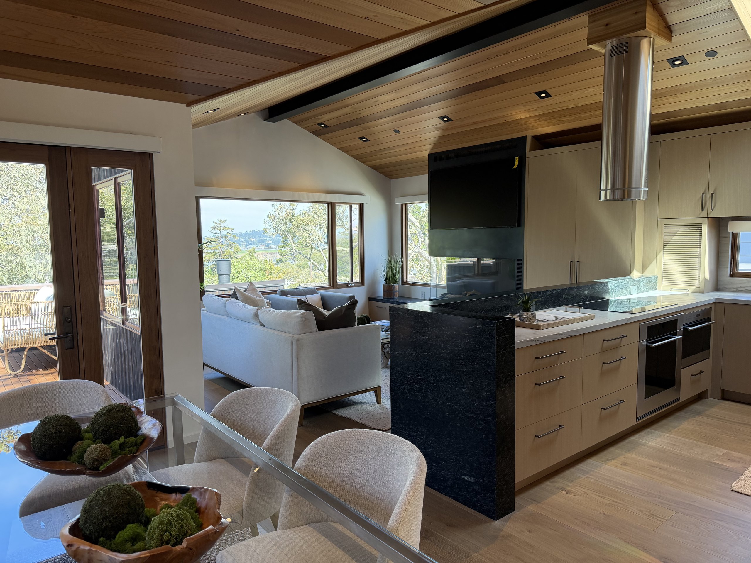 Open plan at Brisa from the dining table across the kitchen to the living room
