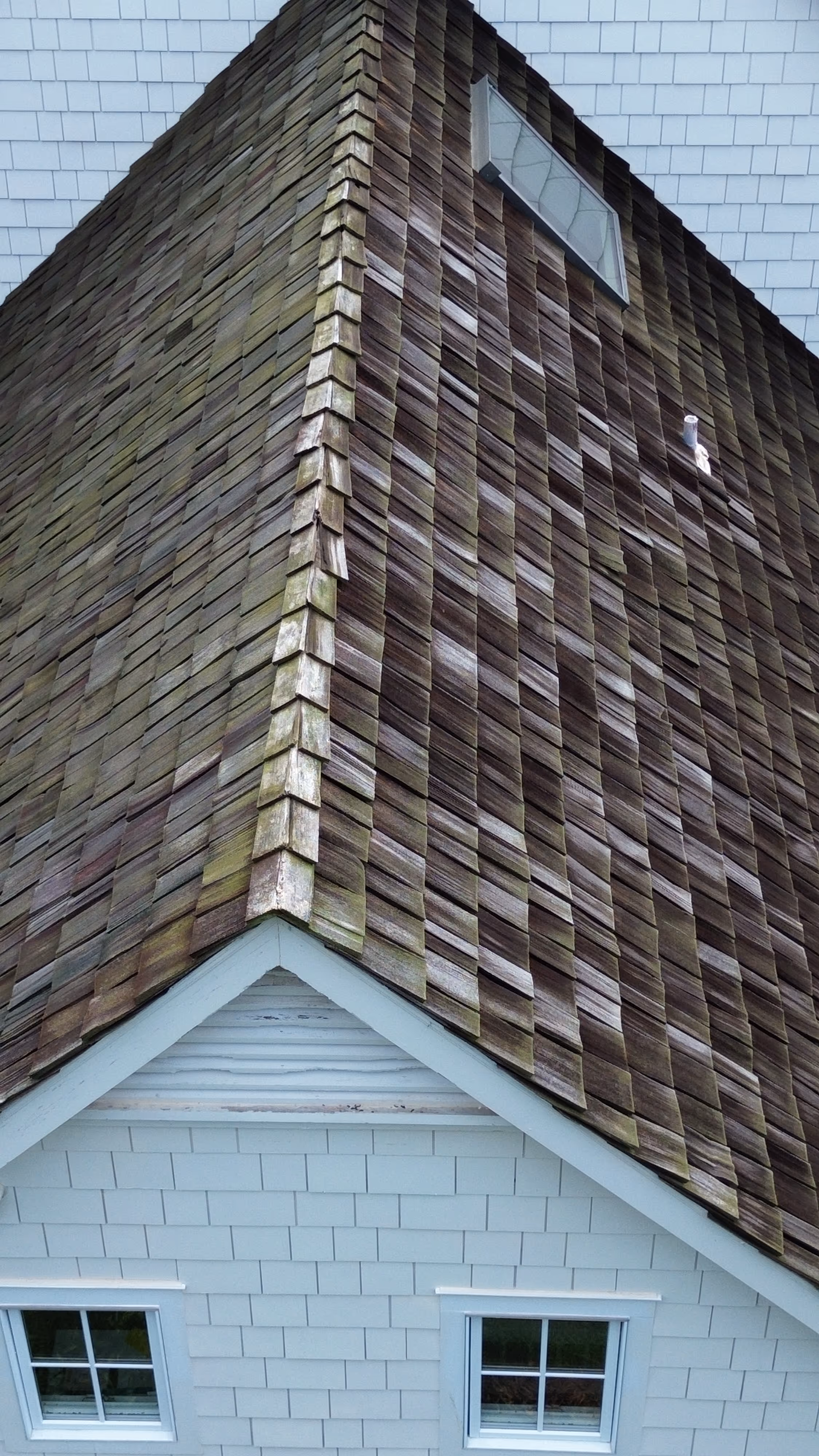 Grey roof in need of repair.