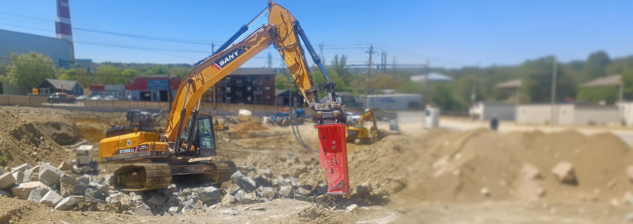 SWT SS155 mounted on a SANY SY265C breaking rock in Nova Scotia.