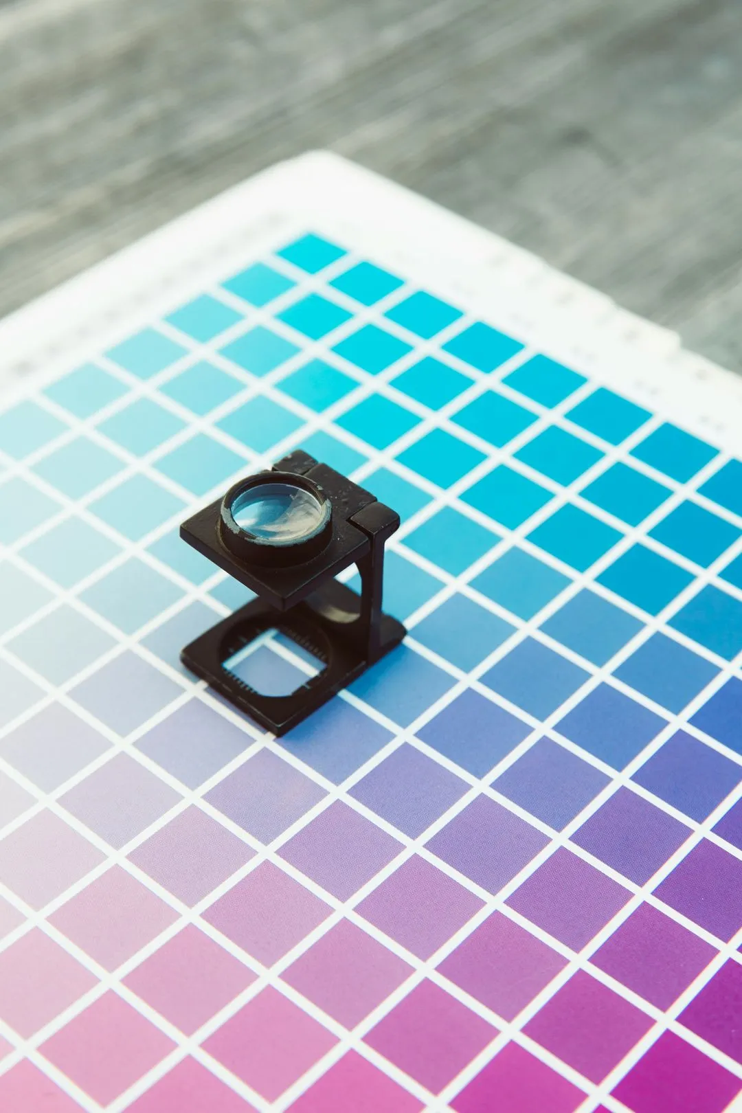A close up of a piece of paper with a magnifying glass on it.