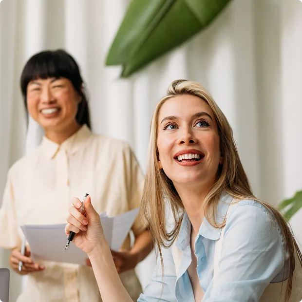 Two women laughing.