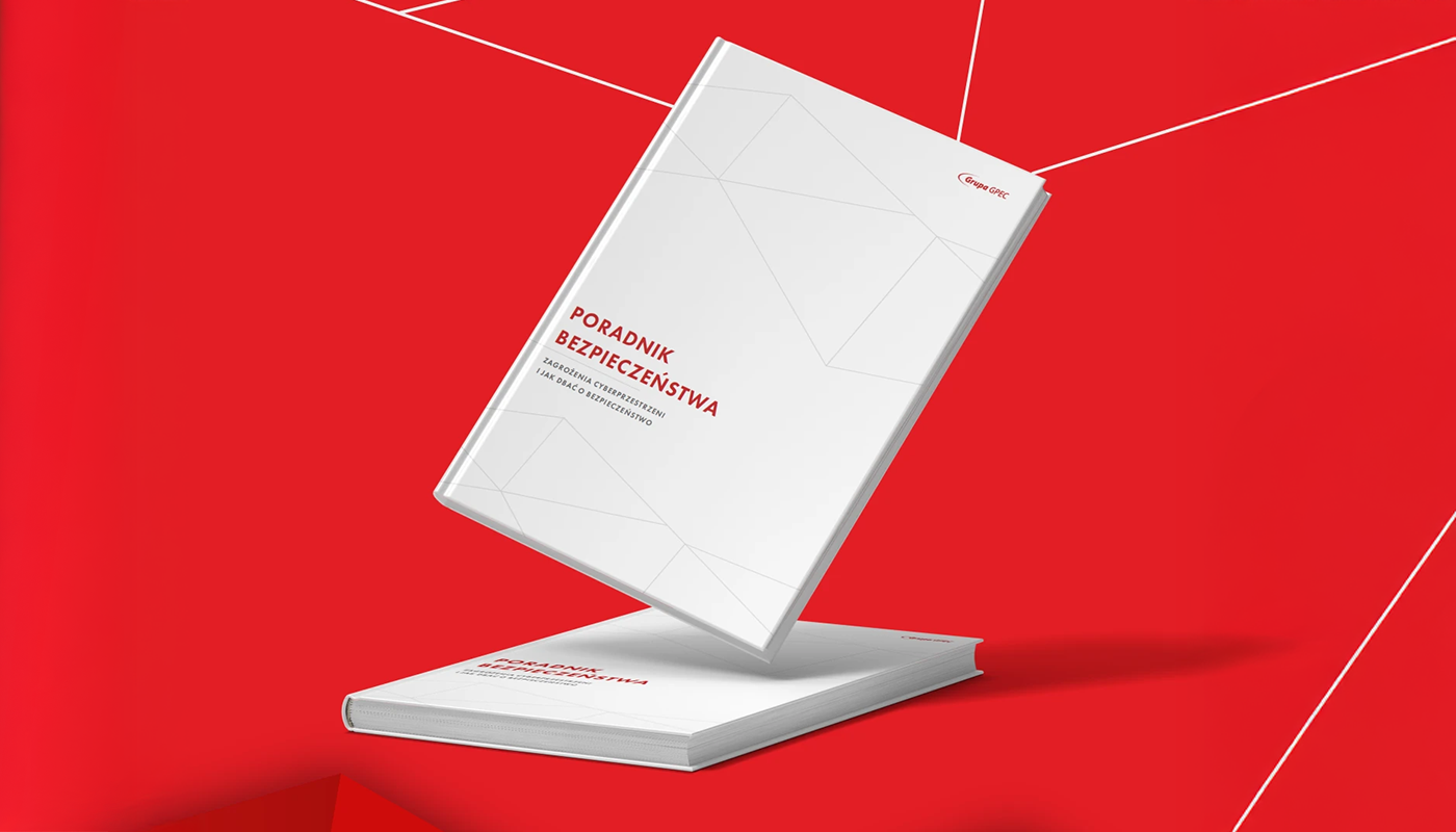 Two white books titled 'Poradnik Bezpieczeństwa' with red text on a red background with white geometric lines.