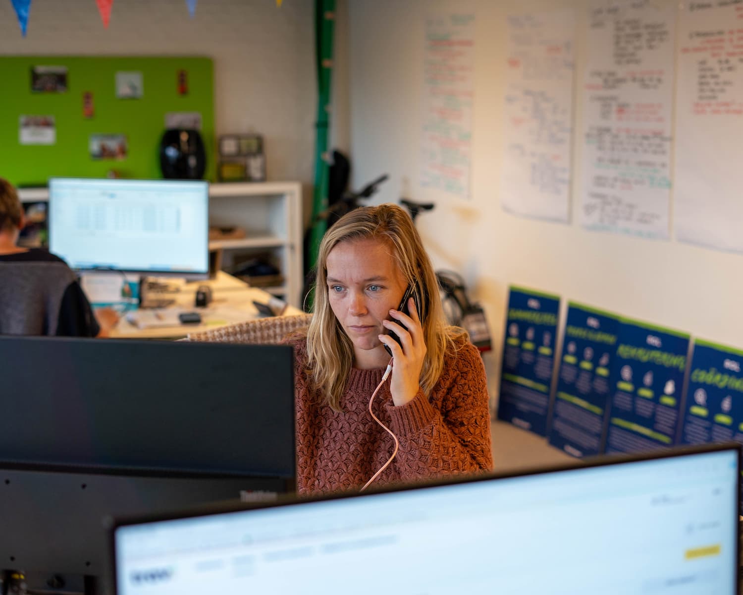 Elleke Van Oers working at her desk