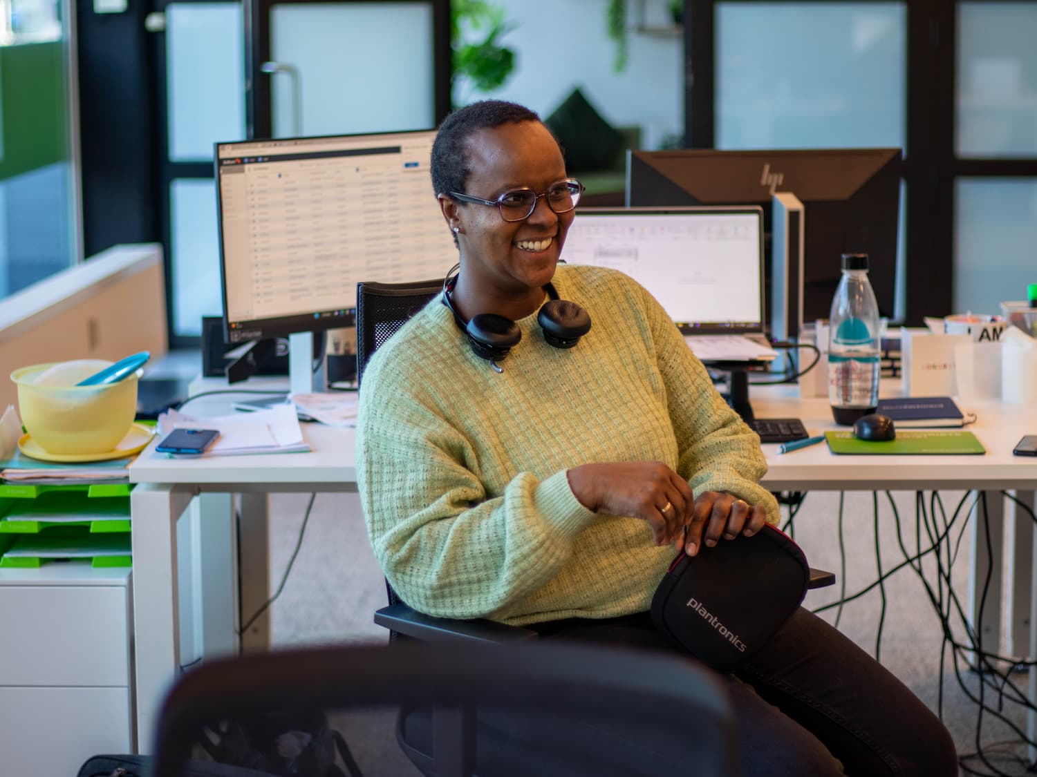 Grace laughing at her desk