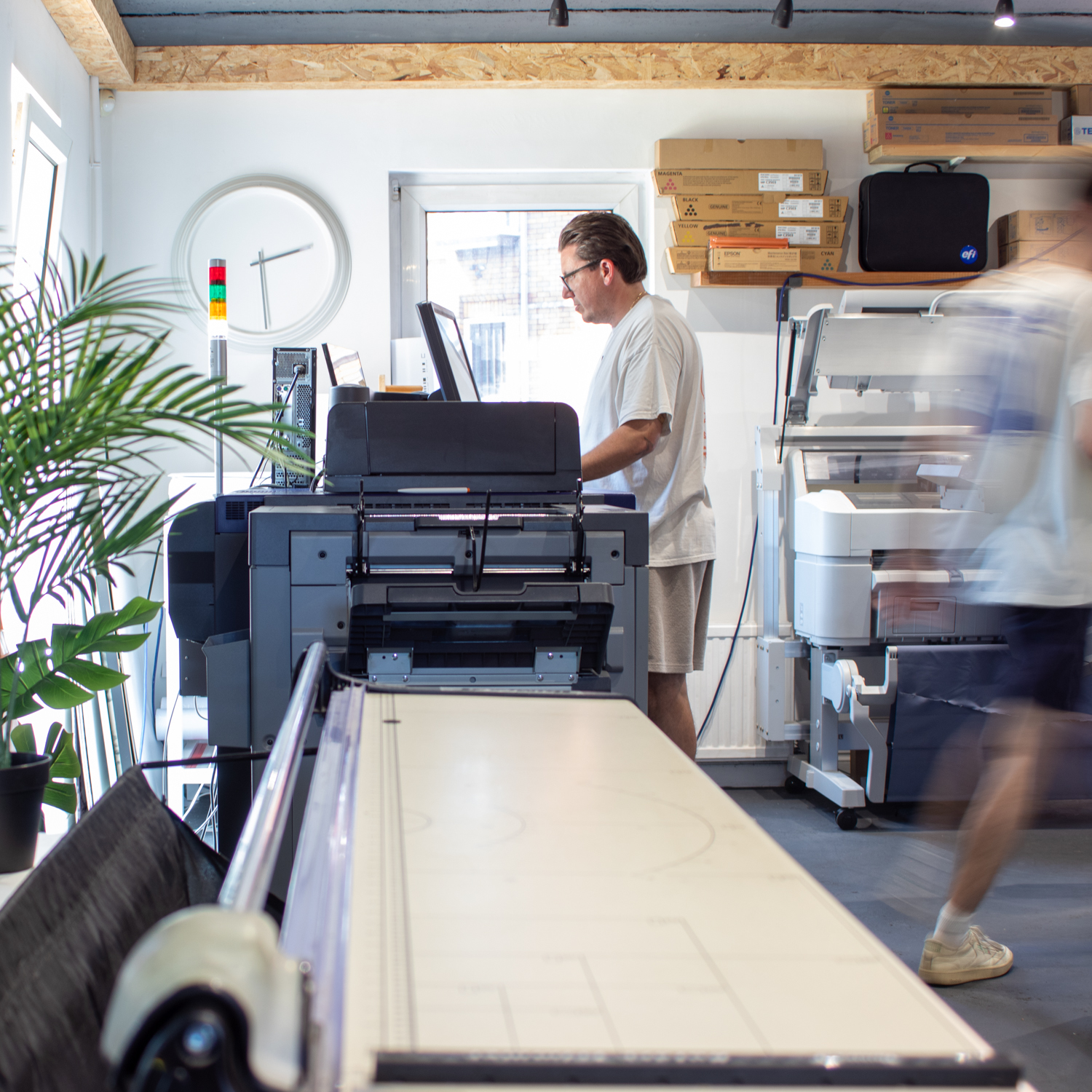 Team member printing in our print studio