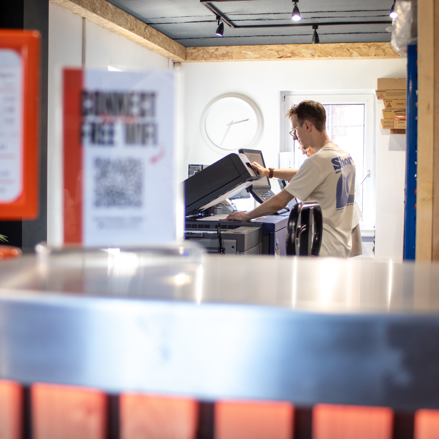 Team member photocopying in our print studio