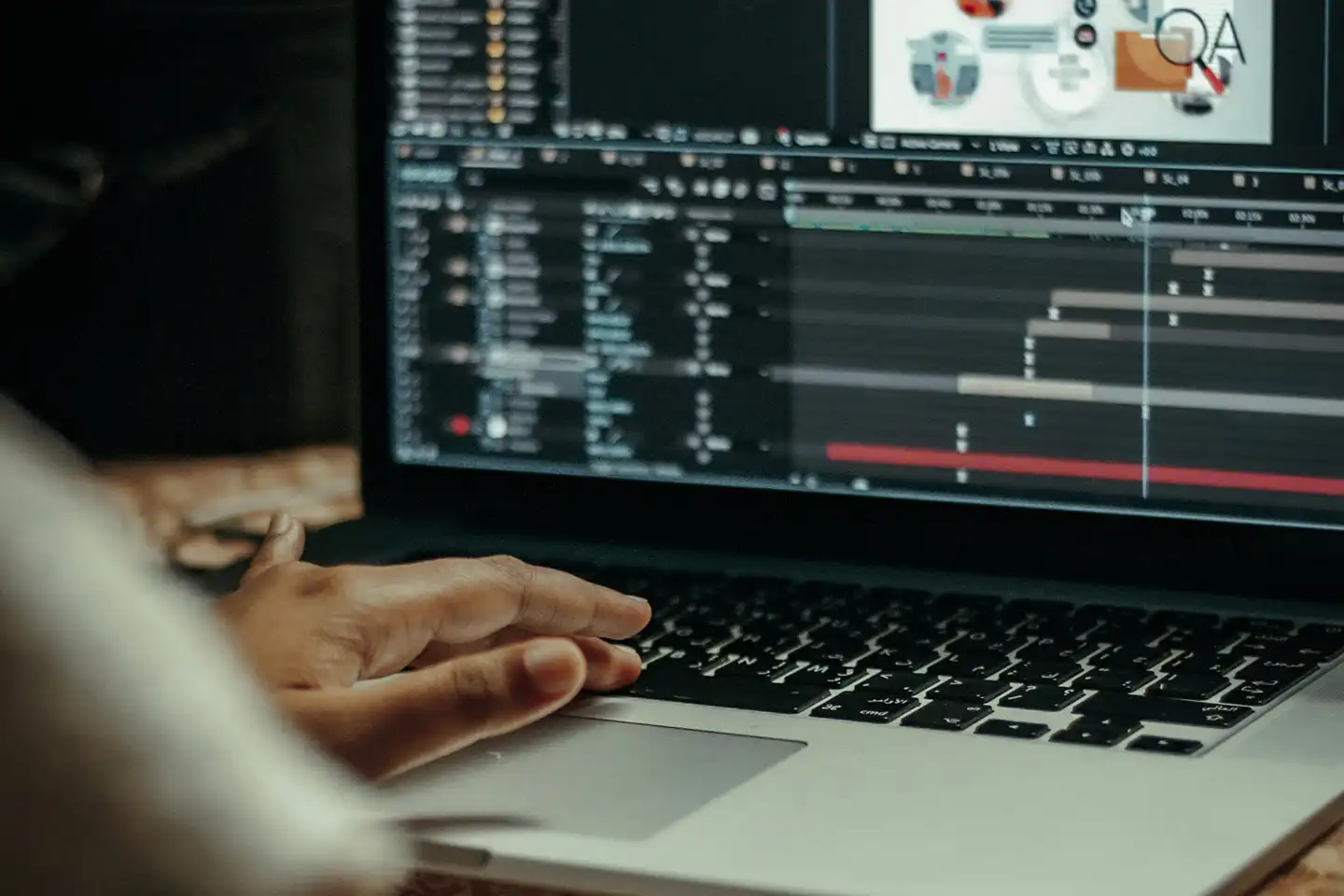 Designer working on a laptop, illustrating the process of creating animated GIF banner ads.