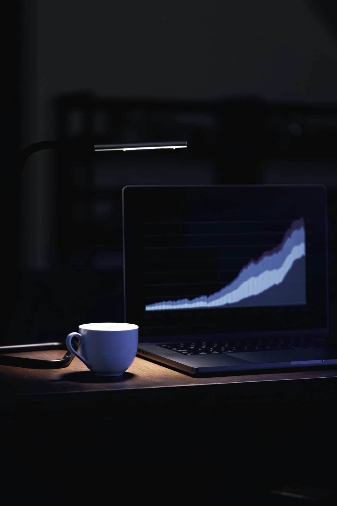 Computer in dim room displaying social media analytics