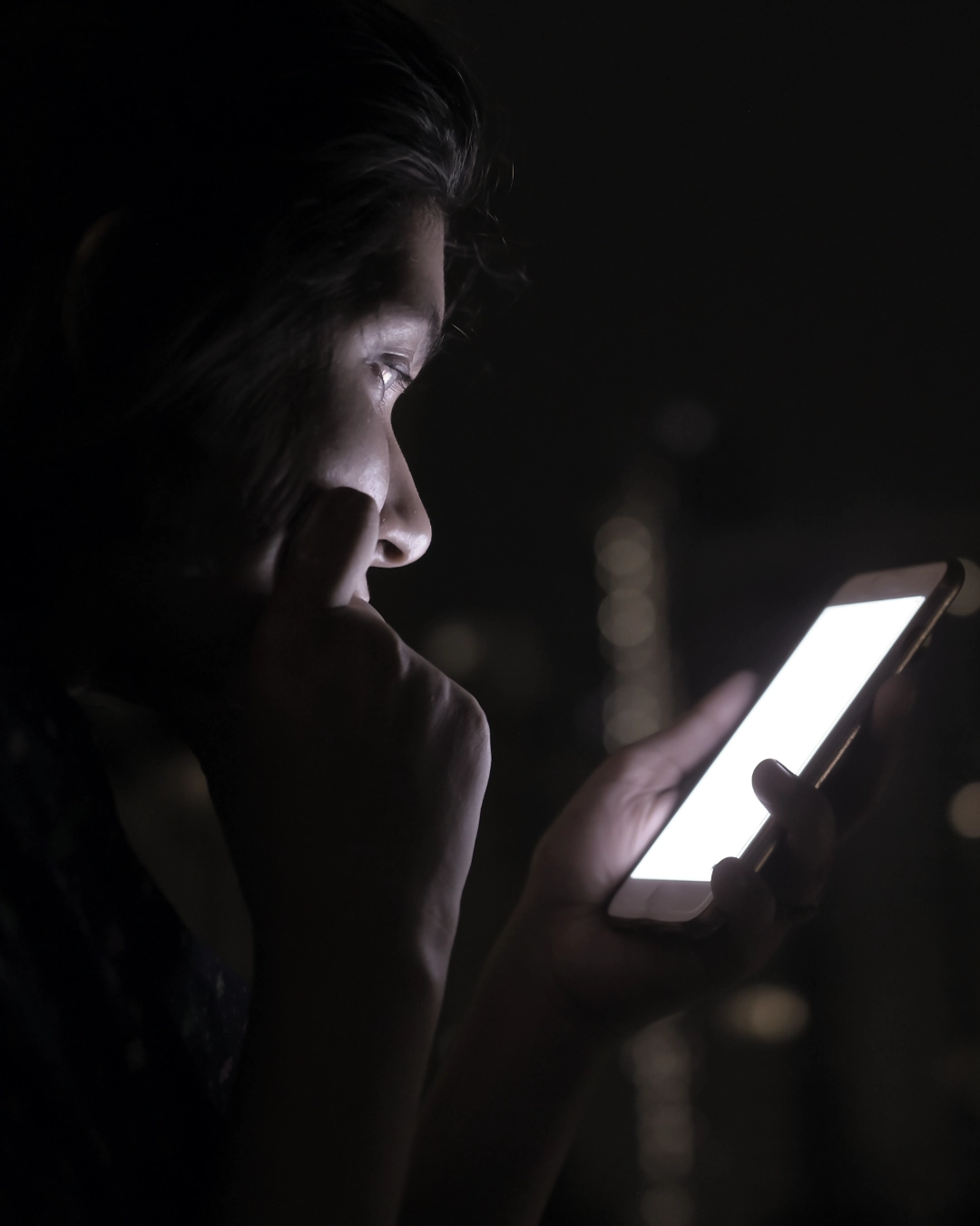 Close up of a woman scrolling through social media on smart phone