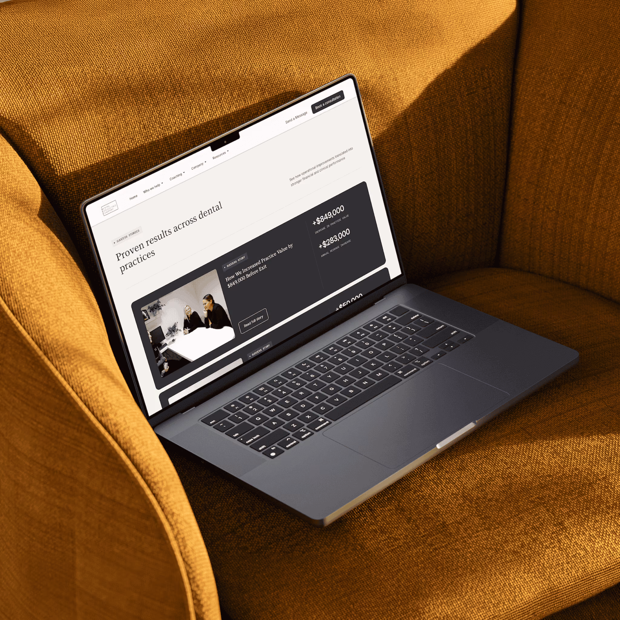 Open laptop showing a webpage titled 'Proven results across dental practices' on a brown fabric chair.