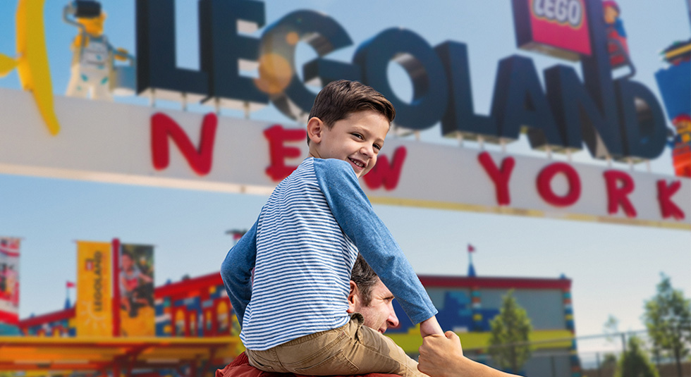 Child riding on the back of his father