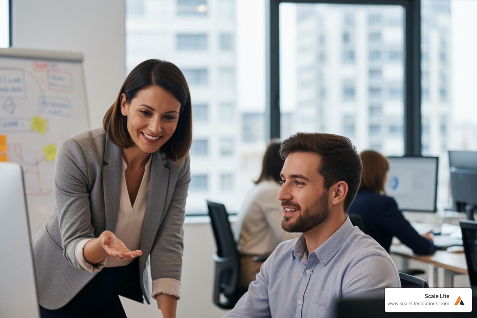 Image of a manager positively coaching an employee - How to improve employee productivity?