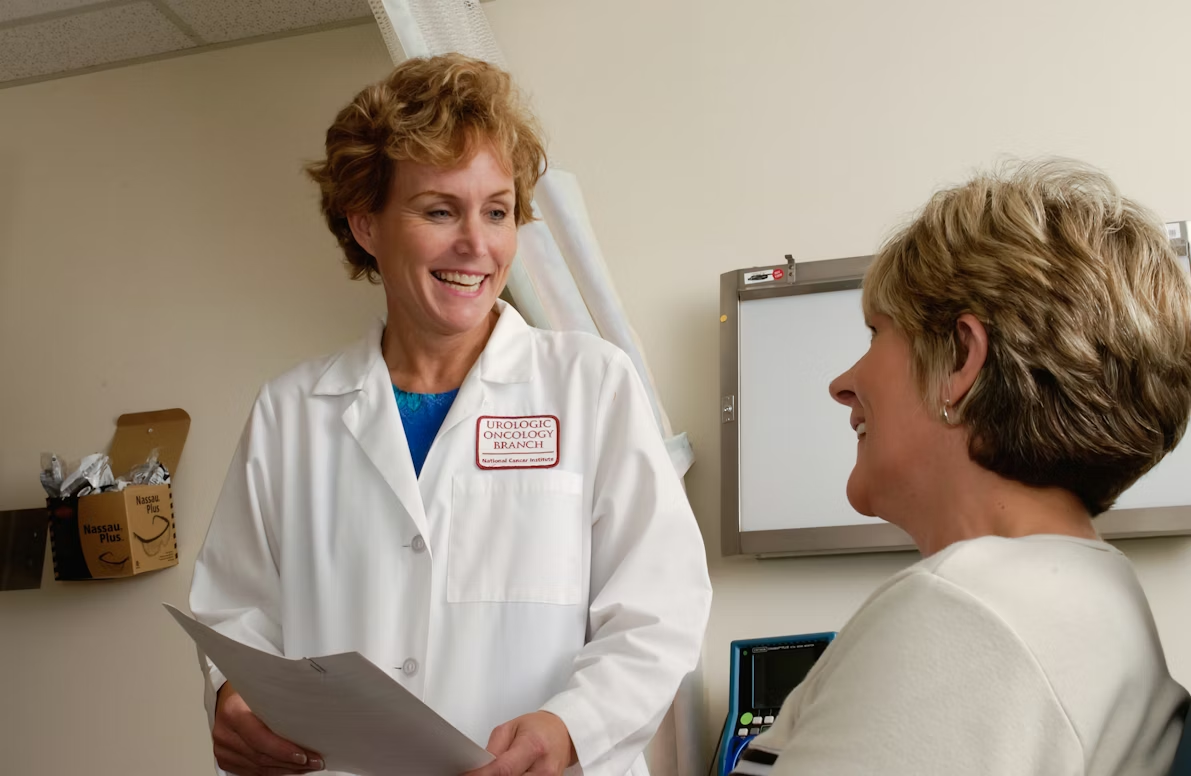 Doctor speaking with a patient during an appointment, illustrating how AI medical transcription captures provider-patient conversations for clinical documentation