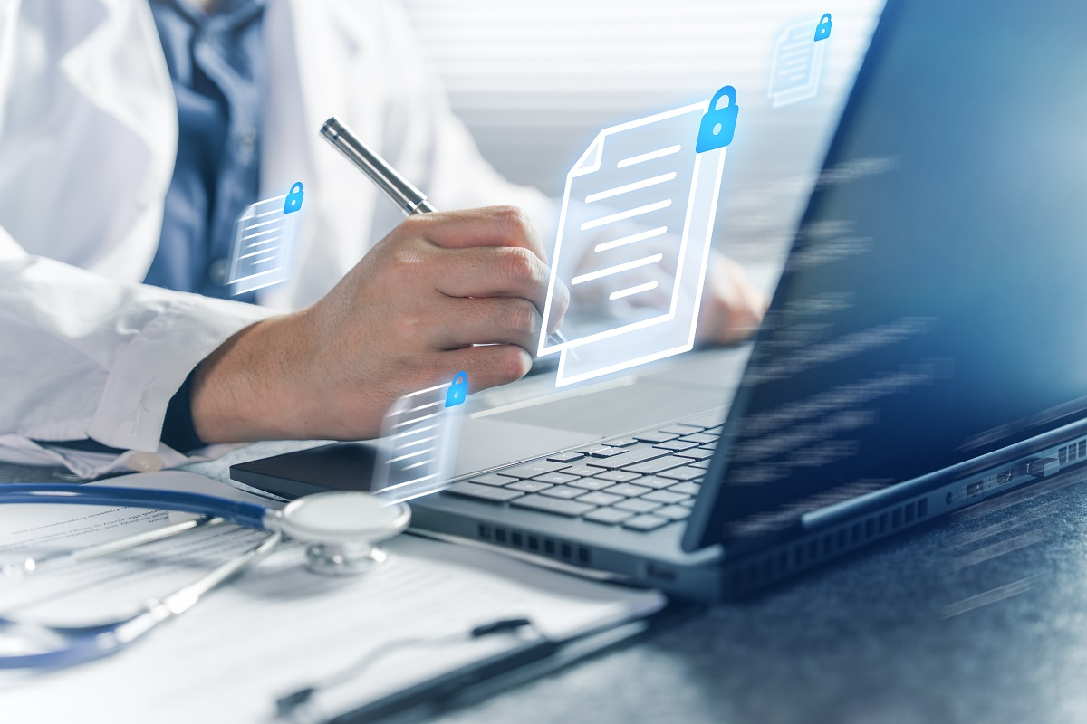 Healthcare professional reviewing patient records on laptop with secure data and compliance icons overlay
