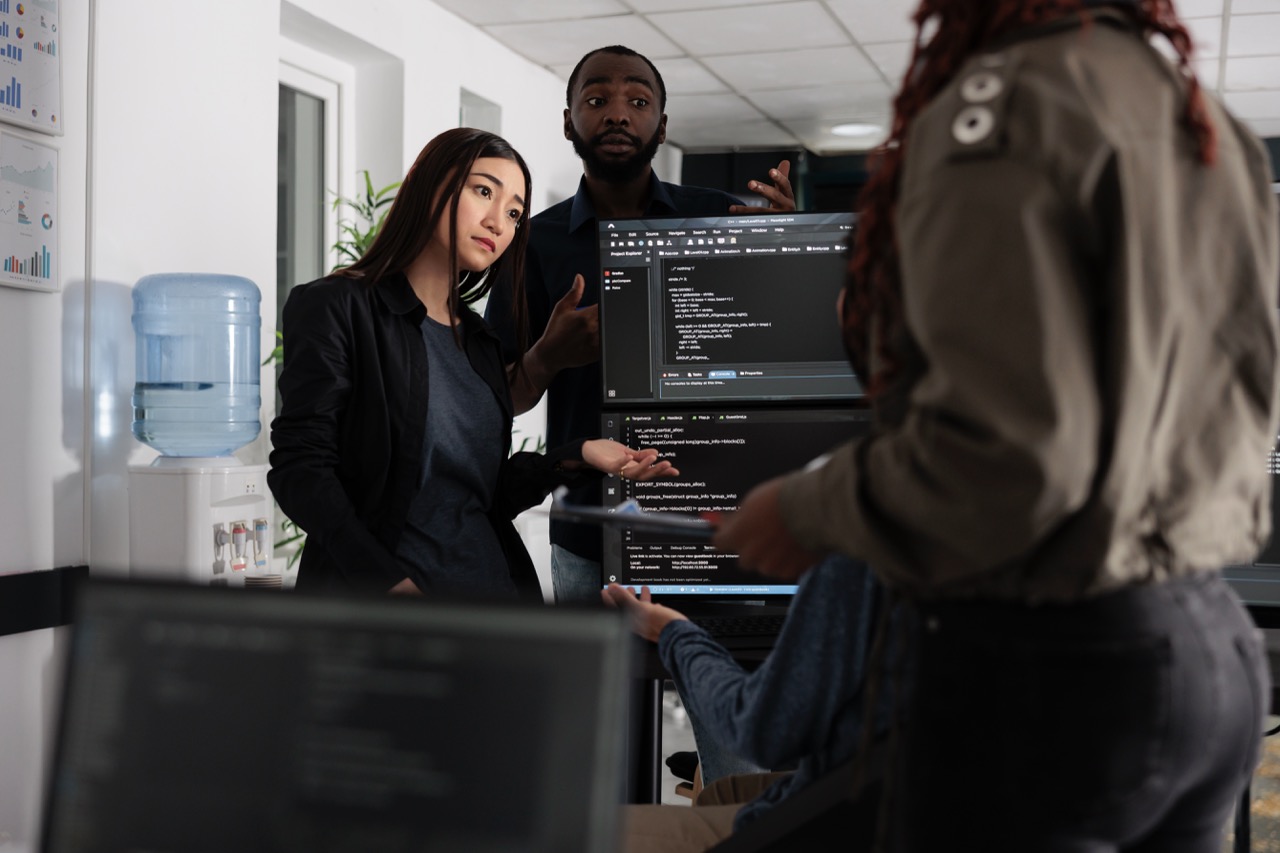 Team explaining something regarding coding.