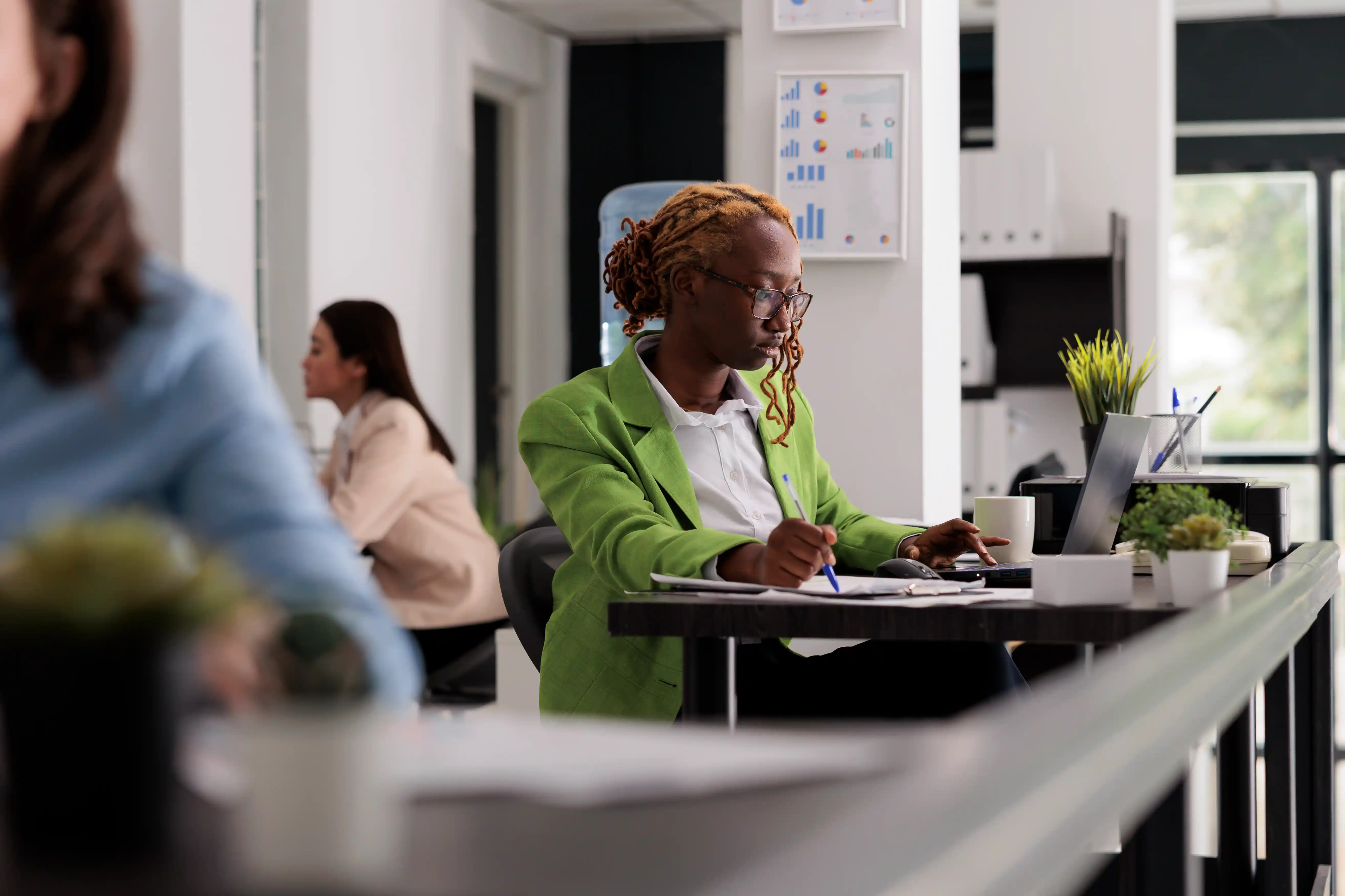 Black woman working in an office.