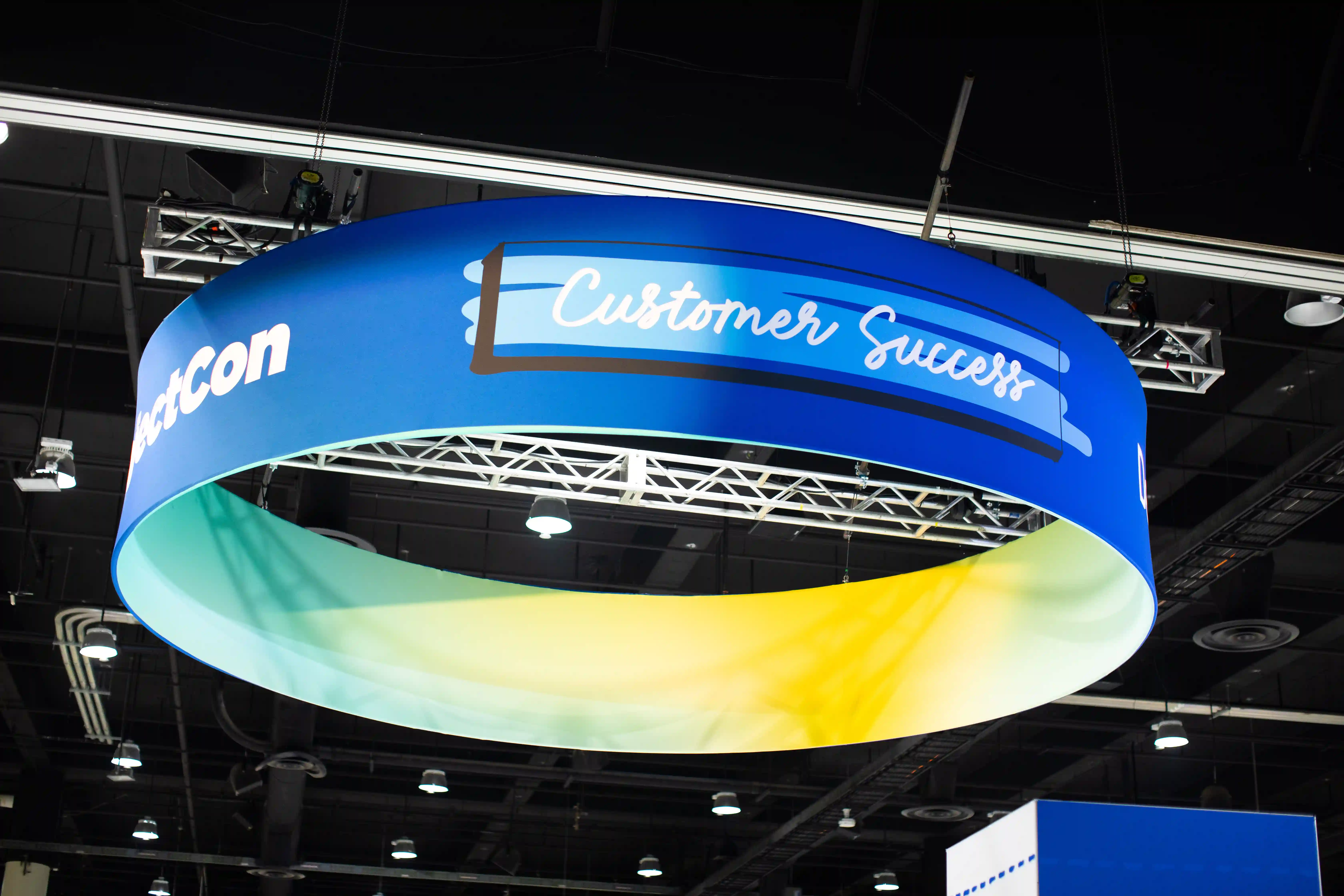 A large blue and yellow sign displaying the words "Customer Success".