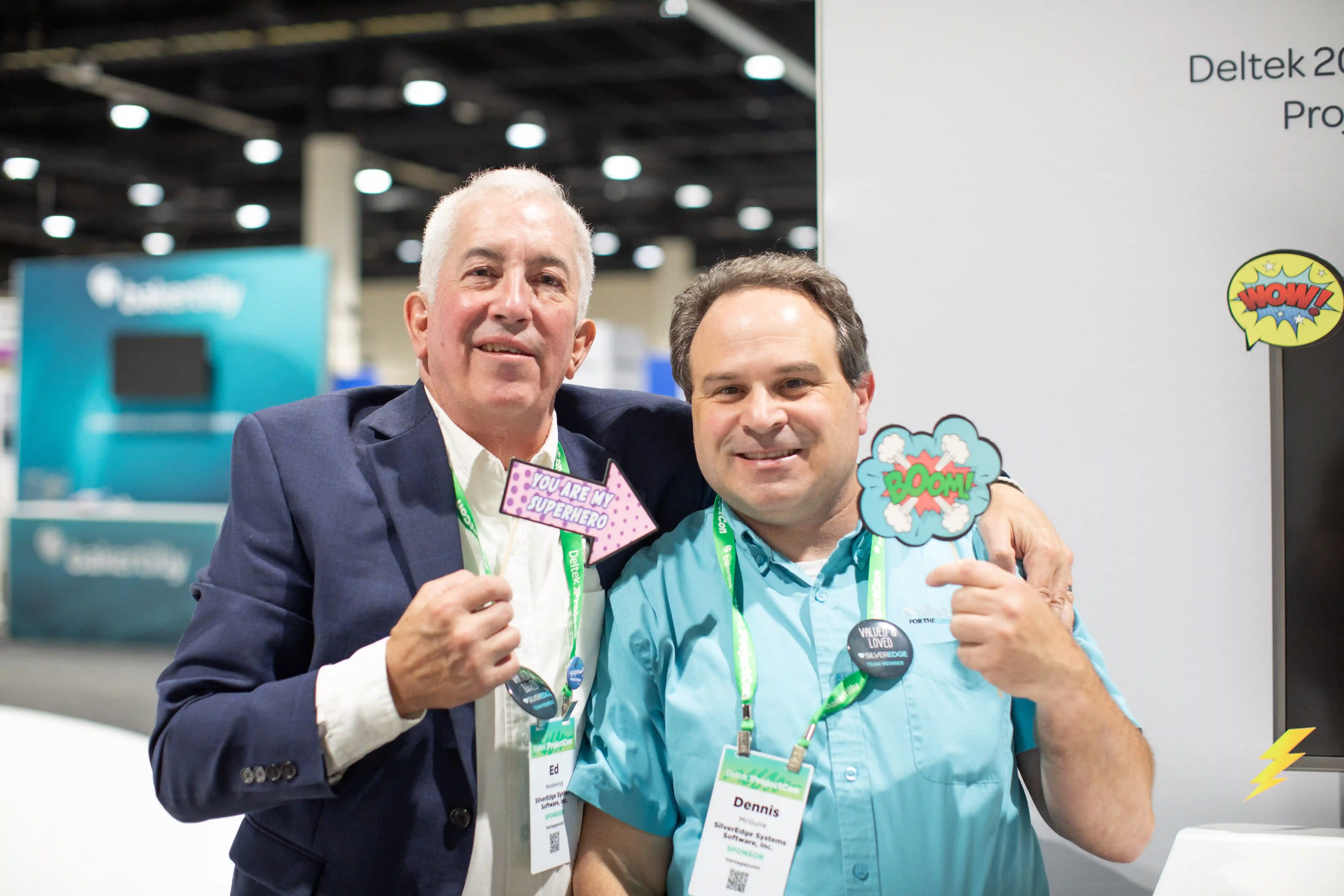 Two members of the SilverEdge's team smiling and posing together for a photograph at a social event, showcasing a friendly atmosphere.