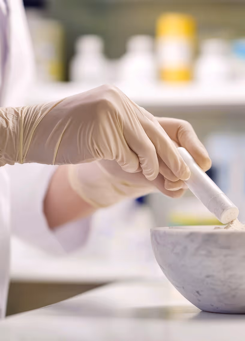 lab tech making a compound