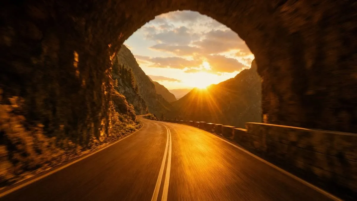 Generated scene: a mountain tunnel mouth opening into low sun