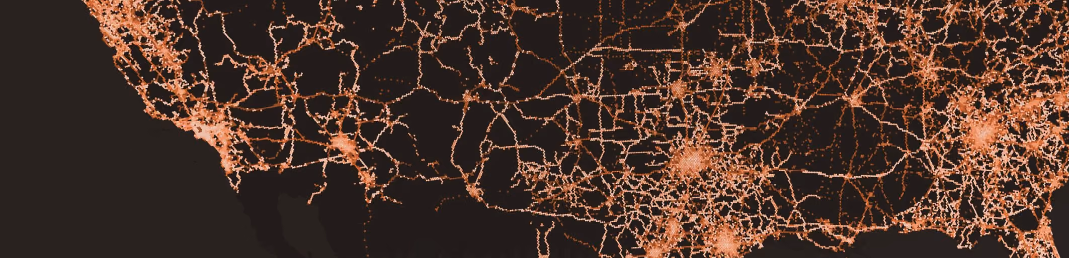 Dense road network across the US, traced in orange on a dark ground