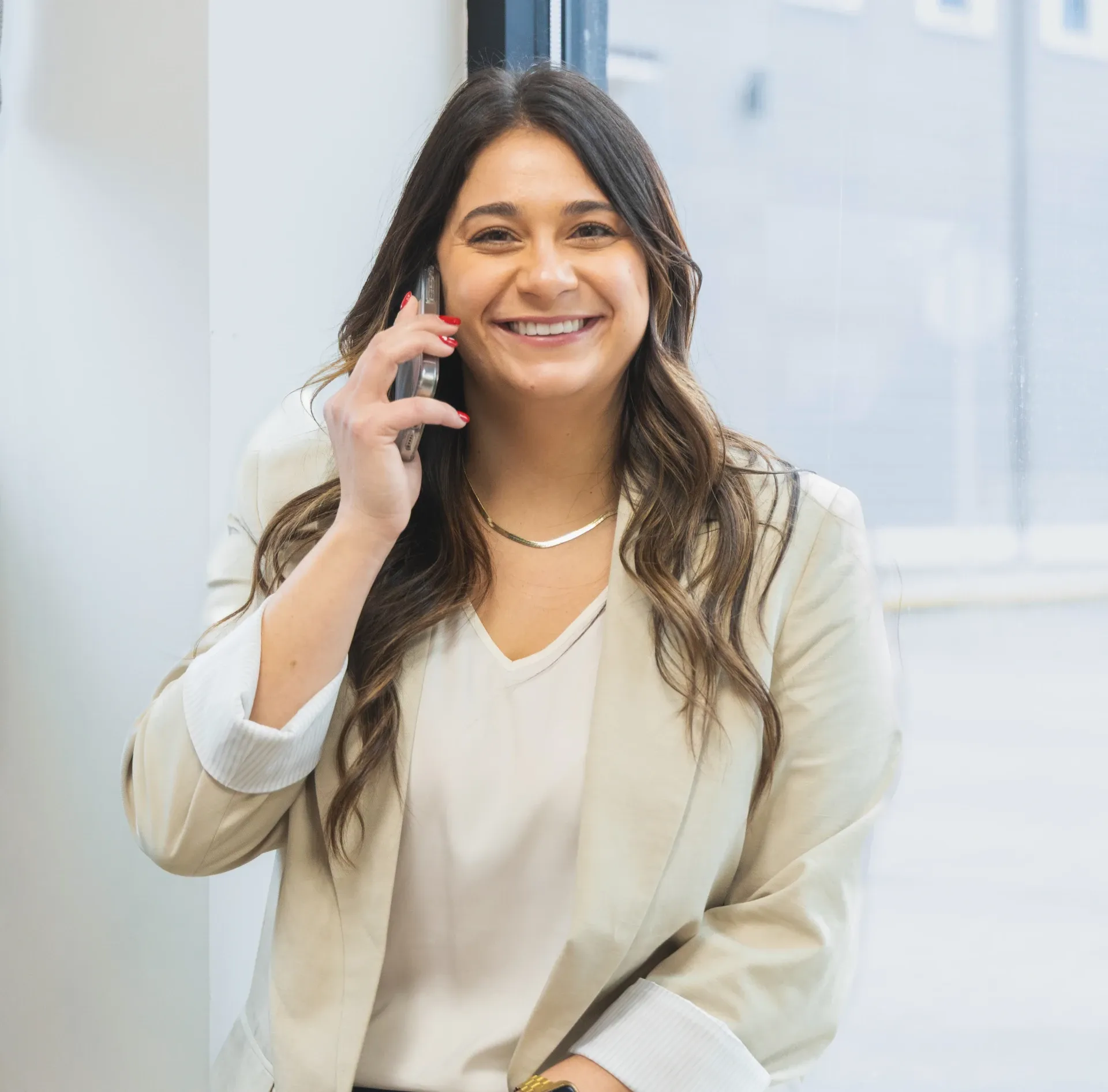 kara smiling while on the phone