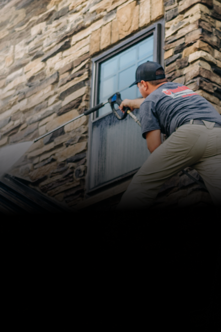 power washing shingles of home roof