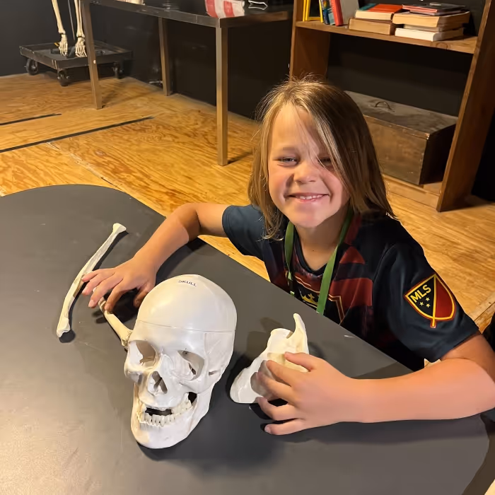 Young girl with a skeleton. 